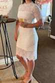 This dress is absolutely beautiful and I got so many compliments from my bridal shower. I typically wear a small in dresses and this was a little bit too tight and if I had the time I would have returned for a medium but I didn't so I stuck with a small. Overall, I highly recommend this dress and I will most likely wear this dress again when we go on our honeymoon. - Alana T.
