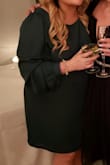 I love this dress! I bought it in green and black and love them! So classy, great material, very flattering - Mallory L.