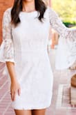 I wore this dress for my senior graduation pictures. I absolutely love it, and the fit is perfect. It's slim-fitting, yet classy and modest. The length was perfect for me, definitely not too long, but maybe a tad short for some. The material is thick enough where I am not too worried about it being see-through. The lace details make this dress feel and look so well made, perfect for a more dressy event. I ordered both a S and XS, and ended up going with the XS! - Anna D.
