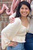 This top is beautiful and makes me feel so pretty and feminine! I like to dress more on the modest side so it is a little low cut for me, but I added a cami underneath and it was perfect. I also wore with some high waisted jeans because the top is a little on the shorter side. I got so many compliments on this top! - Blanca V.