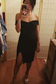 As someone who's secretly skinny fat and hides her permanent food baby under loose/empire waist dresses, I thought for sure I would return this dress. I hate anything that clings to my belly, and in full transparency, I'll still say the front view of this dress is definitely better than the side view. Even with the XS, there's room in the chest for my 32Bs, which is quite obvious from the side view. So I'll probably have to finally invest in a strapless bra to give it more shape.
But okay, back to the front view because WOW! How is this neckline and thigh slit so flattering? I feel like I should be holding a gun and running around in heels like a femme fatale in an action film.
The only reason why I'm giving this dress 4 stars as opposed to 5 is because of the little lapels that stick out on the back. A different reviewer mentioned they look like little wings, and I couldn't agree more!! Such an odd design, and I can't even iron them down. I'll most likely have to safety pin these down somehow. - Sarah P.