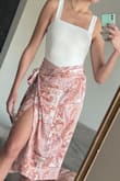 This bodysuit is a perfect simple top that pairs well with pretty much anything. Jeans, shorts, skirts, etc. Love that I can wear it without a bra and it isn't see-through. I am planning on ordering it in black as well! I wore it here with another Lulus item, the Take A Walk With Me Ivory Paisley Print Satin Wrap Midi Skirt and got tons of compliments! I also wore it two days later with jeans for a date night out. :) Definitely a closet staple! - Kellyn S.