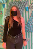 I love this top! So easy to throw on for brunch or for a night out. The material is really comfortable & it doesn't ever come un-tucked out of my pants. I wore it to an interactive art museum in this photo. - Catherine D.