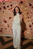 I love love love this jumpsuit! I wore it to my wedding shower and it looked amazing! Everyone loved it. It flatters your back and accentuates your waistline. I was very pleased with it! It does have longer legs so you have to wear heels! I was very pleased and will wear it again! - Maggie M.