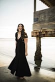 I love this dress. Bought it for an anniversary session with my husband. It's a heavier weight fabric, which was perfect for the weather and made it feel great on. It has just enough flow to it. Can't wait to wear it again for years to come! - Analisa C.