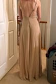 I ended up returning this dress because the pictures of the "blush" color option made it look like a pale / pastel pink, but when it arrived it was a sandy brown color. It is super long so it dragged on the ground even on someone like me who is a bit tall and wearing 5" heels. The fabric quality was decent and I like the design a lot, but because the color did not match the wedding's color scheme it had to be returned and a new dress for the bridal party had to be chosen. Good thing we ordered early!
 I wish the pictures were more truthful to the actual color of the dress. But if you wanted this dress in beige, then I guess it could work for you. - Hailey D.