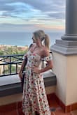 I love this dress! Bought it for vacation and it is perfect. I'm very short (5'0) so it fits more like a maxi dress on me verses midi. It's stretchy and has good weight to the material so it doesn't wrinkle. Not see through. The ruffle sleeves are such a cute touch! Highly recommend. True to size. I usually wear XS in most brands. If anything, I would size down. There was still ample room in the XS on me. - Kristin L.