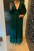 I ordered this dress for an upcoming wedding and I absolutely LOVE it! I ordered a medium and it fits me perfectly. The waistline is sliming and is very flattering for a "pear" shape such as myself. A few things to note: 
1) I am 5'11" and the dress touches the floor. With 3in heels, the dress is the perfect length. For anyone shorter I would anticipate needing to hem the dress. The sleeves are also long.
2) I am guessing that the top would be very tight if you have larger than a B cup bust. It fit me snugly. - Emma G.