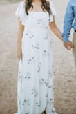Love this dress! I purchased it for upcoming engagement photos (don't have pics yet) but it fits perfectly. It is very flattering and flowy, bonus I feel supported enough to not wear a bra (which is very rare lol). It is a longer dress and will def need to be altered for anyone who doesn't want it to drag. I however didn't mind since it is for our photos and not an event. - Monica `.