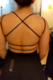 This dress is gorgeous! The material is thick and high quality. There are two thick layers over the bust, so you don't need to worry about buying a stick on bra unless you want to! The fit is super flattering, especially for hourglass figures! I am a powerlifter with decent size lats and glutes that never fit right into anything. This dress has plenty of room for lats, while also being cinched at the waist and flared out enough for plenty of room for my thicker lower half. - Rachel S.