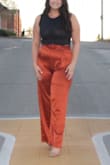 I usually wear an 8/10 in pants, I'm wide in my hips so I figured to size up since satin doesn't stretch. The XL works perfect for me! The zip up size helps the pants flatter your waist. They're super comfy on, I don't feel restricted at all & can sit and squat just fine. Such a beautiful color! - Emily M.