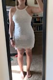 It is loose but not in the way where it doesn't hug your curves. It's a comfortable fit and a great length since I have very long legs. There is a lot of room for mobility in the arms, no tight armpits (since that is something that I absolutely hate) I really don't have anything bad to say about this dress. - Kayla S.