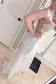 This dress is really pretty but itchy. I really liked the top. The glitter was everywhere! It fit great but ultimately not for me. I really really wish it had more if a train. I ordered a size 4 and it fit really well. - Danielle W.