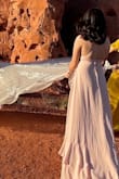 The back strappy detail and the ruffles on the front and the dress makes it so perfect for the sprint wedding guest. It fits true to size. The length of this dress is perfect! Got so many compliments - Vicky C.