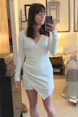 I bought this for my wedding rehearsal and I love it. I was deciding between a S & XS and based on reviews I decided to choose the XS. It fits me perfectly. Couldn't be happier with the style/fit! (The sleeves are a smidge too long, but that's not an issue for me!) - Elise L.