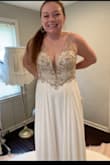 This dress is great! I took my own measurements at home and it fits true to size! I am a little bit bigger busted and short but requires very minimal alterations! It does come long, but it is truly beautiful in person and looks way more expensive than it is! I'm so excited to wear it on my special day - Amanda C.