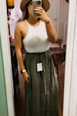I wore this skirt for my engagement pictures and it is super cute when dressed up! It was a little tight at the top but not enough to size up! The material is thick and so soft! - Heather G.