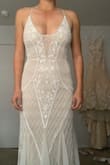 LOVED this dress so much! Was obsessed with it just from the pictures before I ever put in on. Had it altered just to open up the back a little bit and it was the perfect reception dress for my wedding when I was ready to let loose and dance! - Sarah N.