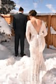 I loved this beautiful lace wedding dress. The lace looked beautiful with out pictures in the snow. I was in between needing a small and medium, I ended up going with the medium, I added a hook and eye on the back for the small gap in the waist and it worked beautifully. Highly recommend this beautiful and affordable wedding dress! - Emily E.