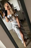 This skirt is absolutely gorgeous in person! I like that you can buy the skirt and the top separately for this two piece. I got the skirt in a Medium and the top in a Small. I love it and can't wait to wear it out downtown with my husband as the weather gets warmer. You won't be sorry you ordered this! I plan on wearing a small heel sandal with it, but even flat footed it wasn't extremely long like the maxi skirts tend to be. - Lisa F.