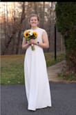 This dress has a great weight to the bottom portion and sits nicely on the shoulders. My original dress did not fit and this one came in and worked perfectly! I really appreciate the reviews before mine, because I didn't know much about this site. Highly recommend!! - Lauren G.