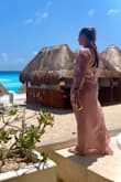 I absolutely love this cover-up.  It fits great and feels very upscale. It is sheer so I wouldn't wear as a dress but it is perfect as a cover-up. I received lots of compliments on this. - Erin R.