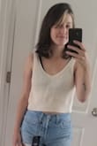 This is super cute. I just had a baby in December and this is nursing friendly and really cute. I sized down per other reviews. Still flattering on my mommy tummy. - KAITLIN P.