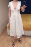I ordered this dress for my mini-wedding. It had to be shipped to Europe, so returning is not really an option. Normally I wear size M, and sometimes around the waist I need L. So I thought, if it runs a little big, I'll be fine. I can always take it in. But no....The dress is two sizes up in the waist and also way to big around the chest. I'm really disappointed, because taking it in is not an option with this much a size difference. Little note with the picture: The back is not placed as it is supposed to be, because it is too big I crossed over two pieces of lace to make it fit.
Other than that: Beautiful lace, really pretty dress!!! - Gerlant D.