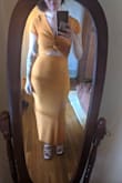 I was hesitant to buy in my usual size bc of other reviews mentioning they had to size up, but I stuck to my gut and ordered my regular Lulus size. I am glad I did! It's a form fitting dress, but it looks great and covers up my lil tummy flub nicely. The orange is a bit more muted than the picture suggests, but still a lovely color - Megan K.