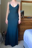 This was very fitted and I ordered an XS based on reviews but a S would have been better. The green color is very pretty. Feels like a thick, quality material. In 4 inch heels I do not think I would need to get it hemmed. The straps are adjustable but look a little cheap and are very wide set in the back. - Michelle M.