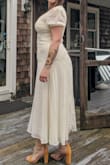 The color, the shape, the length, the fabric!! All perfect. The dress is perfect, but it fit a little snug on my pandemic body. Not the dresses fault. I wish it came is all different colors. - Nadia T.