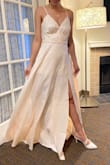 The dress looks okay, not what I expected completely though, but my family loved it. I think this is just a me thing rather than the dress. The inner lining is too short for me, which is odd. Have a look at my pictures and judge for yourself. The length is perfect, doesn't need hemming for me. - Alma R.