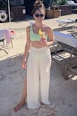 I loved wearing these pants on vacation. The slits on the side make them cozy and breezy. The waist band fit true to size but the pants are loose and long. - Cathy C.