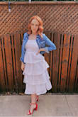 This dress is gorgeous! I ordered a size medium, as that's what the size chart said I was, but it was very big in the waist and bust. I had to have it taken in. I'm a 32 DD, 130 pounds, and I'm usually a size small. I'd definitely size down to a small next time. Also, the pom poms are adorable, but they lay all along the zipper, and they get terribly stuck. At one point the zipper got so stuck, I thought I'd never be able to fix it! I had to cut them off so it wouldn't happen again. But otherwise, this dress is so gorgeous! I've gotten countless compliments on it! - Abigail S.
