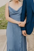 I was a little nervous about purchasing this dress because very few reviews had been written about it yet, but I absolutely LOVED it! I wore it to my brother's wedding and it fit PERFECTLY! I regularly wear a small, but I am not a teeny-tiny, nor a perfectly proportioned person. This dress did a wonderful job of accenting my figure without overemphasizing my belly region, which I was afraid this dress might do! The slit in the dress is sexy and classy without showing too much and the fabric is classic. My only warning is that the top portion of the dress easily falls open due to its design so the wearer must be conscientious and ensure they do not EVER bend over without holding the top of the dress closed, including leaning slightly forward in chairs! Oh, and the dress is quite long! It brushed the floor even with the tall heels I wore and I would imagine any wearer shorter than 5' 4" will definitely want to hem it. - Cayla B.