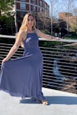 I loved that this dress was made nicely. Great quality and the straps at the back are a beautiful detail. The only downfall was it was hard not getting mixed up in the strings when you put it on. I also had to have this dress hemmed a lot. I am 5'6 and had 2-3" heels and still had a few inches taken off the bottom AND it still touched the ground! But it is beautiful skimming the bottom of your shoes. - Lisa F.