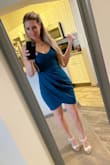 This dress is made nicely, but there should be a zipper on the side or back for ease of putting it on and taking off.  It does stretch, so that helps.  Because it's a body con dress it's very form fitting and tends to ride up a little when I walk and I find myself pulling down on my thighs ever so often.  The fit and style of the front is very flattering, and the length is perfect and sexy.  I would definitely buy this dress again. - Lisa F.