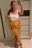 I love the color and fit of this skirt! I thought it was super comfortable. It shows a decent amount of leg when walking. I really love how soft and stretchy the material is! I usually wear a 4/6 and the small fit really well. - Jaclyn V.