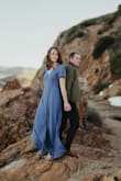 I bought this dress for my "formal look" in engagement photos and loved it! It was comfortable and cute in equal measure, and the loose crinkly material was forgiving with regard to wrinkles on our long drive out to the photo location. It flutters and has lots of movement in a breeze, so our photographer got some cool shots with it.
Consider wearing shape wear underneath, not for the shape itself (the dress is oh so flattering!!) but because the slit at times flaps open in the wind.
Other reviews say the dress is quite long, that's probably true, I'm tall and the length was perfect for me with a two-inch heel.
I love this dress so much, I've worn it for family events and going out to dinner after our photos were taken. I've gotten lots of compliments! This dress is a great purchase all-around and I'm so glad I bought it. - Christa M.
