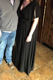 I loved this dress! I wore it as a wedding guest. The bust was a little tricky - I tried to use safety pins (the button wouldn't stay together for me) and they seemed to slide frequently. This was my first wrap dress and I loved that you could make it as tight or loose as you wanted! I went up in size and was glad I did. It does run long but I did not have to alter it once I put heels on. Love that it comes in numerous colors! I'd definitely consider purchasing another color in the future. - Keegan B.