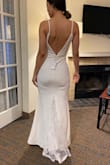 This dress fit me too tight, I think a small would have been more appropriate for my hips, but then the top would require alterations, the length is a bit too short for me at 5'6" and wearing some small heels. Overall, the dress is nice, and I can see it fitting certain body types very well, but didn't do it for me. - Alma R.