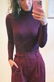 This bodysuit looks perfect on and was very soft and comfortable. The sleeves were long, too, which I love.

I normally wear XS in tops but I have a long torso, so I got the Small. Even the small definitely pulled on my crotch! Lol. But it was fine. - Hannah V.
