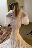 Dress is so pretty and comfortable. I was afraid the sleeves wouldn't fit my arm but they fit. It's perfect for my boho wedding. - Natalie V.