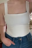 I like this a lot and love that the straps are wide enough that you have the option to wear a bra. The front half is this nice thick yet breathable material. The material on the back half is really see-through though. Makes the bra situation more annoying. - Ashley F.