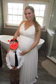 I bought this in Large because I knew my belly would grow by the time we had the ceremony. Lrg fit perfectly over my 36 week bump and the straps adjust so I was able to tighten. Worked out beautifully. Bought a rhinestone belt from Amazon for a finishing touch. - Erica C.