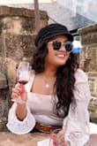 Wore this to a castle winery and I loved it so much. Perfect mixture of casual and dressy. I did have to steam it before wearing it bc it does wrinkle. Even with the back cut out you can still wear a bra perfectly fine with it. - Pechiney S.