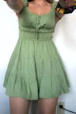 I added this to my cart last minute and I love it the most! This dress is so fun. You can adjust the tie and chest area to change the look. It can also be worn off the shoulder! I purchased the green and it is a bright, vibrant color. The shape is very feminine but modest. It looks great with sneakers and heels. Most jackets pair nicely, too! One of my new favorites :) - Taylor B.