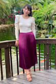 I wore it for a wedding and it was great! I accidentally pulled a thread when zipping it up so zip carefully. It runs a little large, I ordered a small, but I think an extra small would have been better since I wanted it to sit on my waist and it fell below it, be sure to measure your waist before you buy it. Vivid color. - Daniella T.