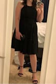This dress is so cute! It has adjustable straps which is great. It's a little bit of a heavier fabric making the skirt feel full. It's super comfy to wear, and a very versatile little black dress. Your favorite strapless bra can be worn with it. It makes you feel pretty! I highly recommend it! - Maronda C.