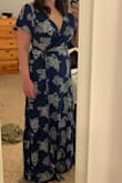 I love this dress! The cut it perfect! However, I did order the same size in black and the cut was different. I didn't like how it fit so I returned it. So be aware that if you order 2 of the same dress they may be cut differently. But this blue dress fits perfectly! It shows just the right amount of cleavage to feel sexy  but not too much. It's so fun to wear. The length is a little long for shorter people, but I tried it with 2" heels and it worked out fine. The material is light but not thin, so hopefully it'll work perfectly for a Hawaii wedding. You can also wear a regular bra with this dress. - Maronda C.